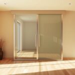 Energy-efficient sliding glass door system with dual panels, sleek metal frame, and natural light streaming into a modern, sunlit living space.